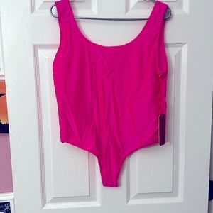 hot pink body suit